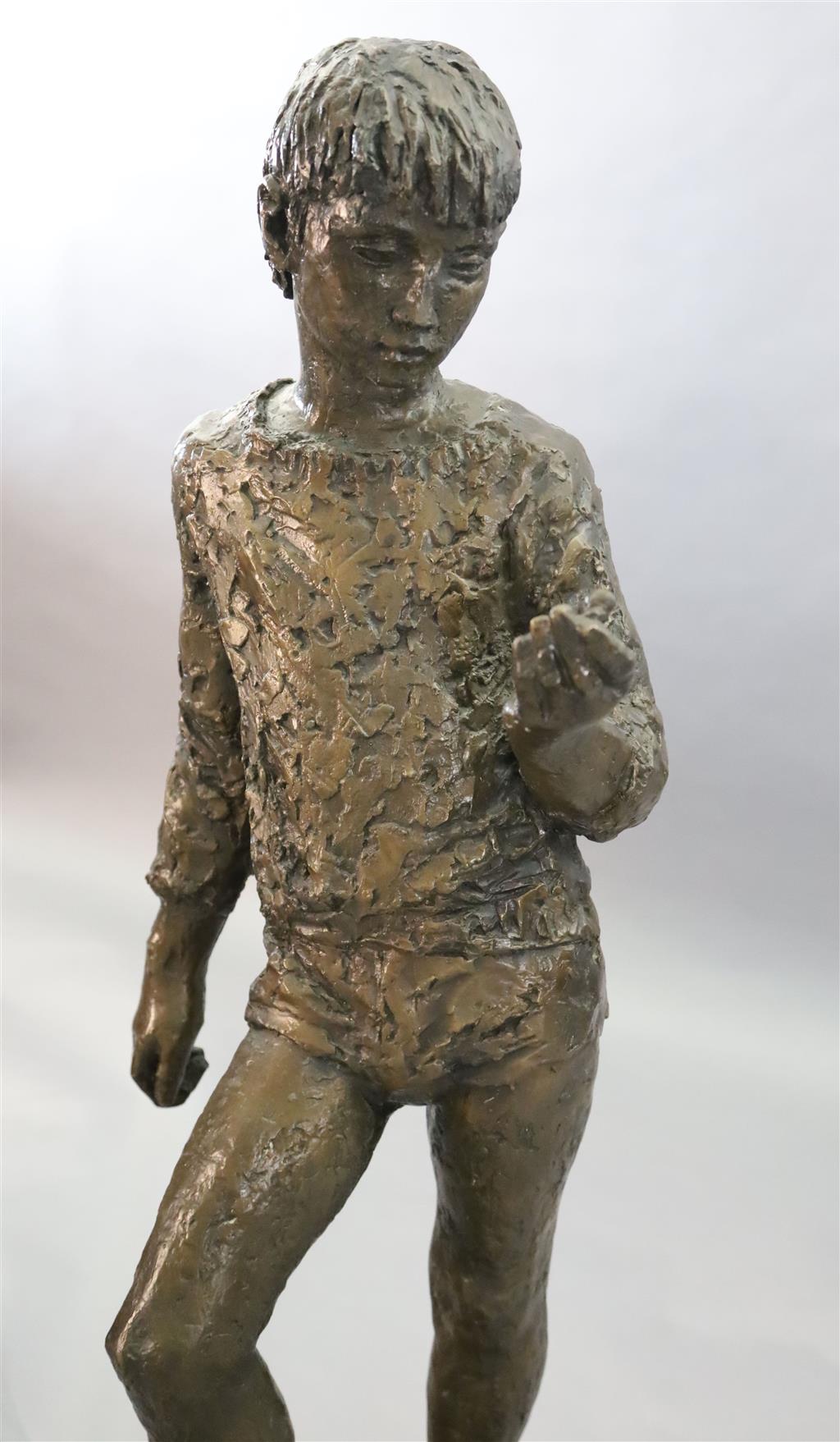 § Karin Jonzen (1914-1998). A bronze figure of a standing boy holding an ammonite shell, height 44in.